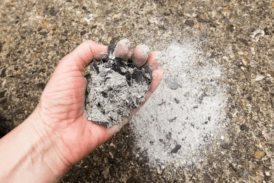 man holding ashes
