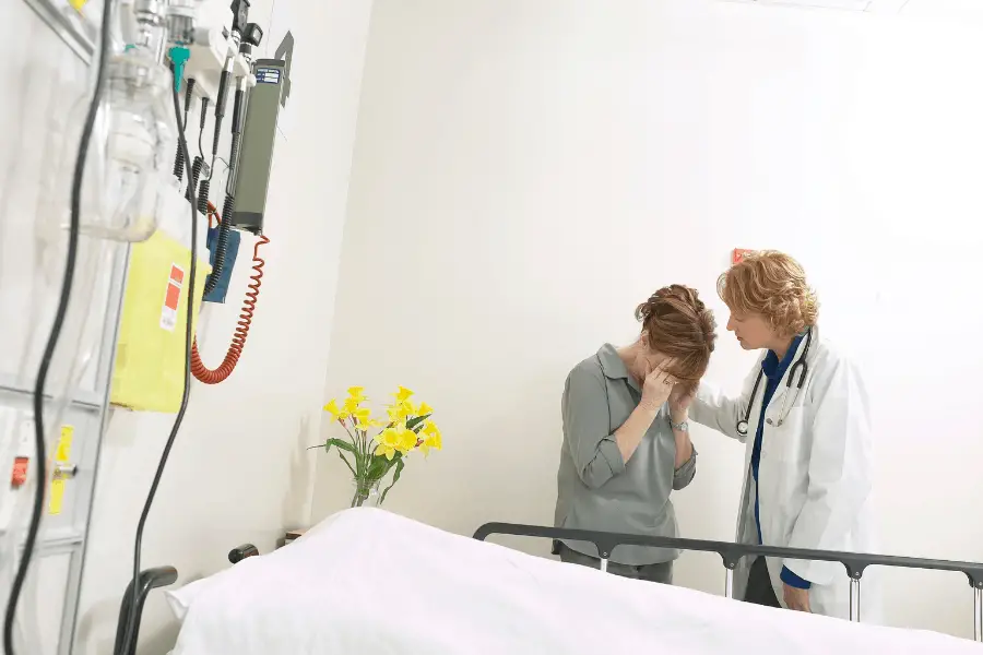 woman crying in hospital over dead relative